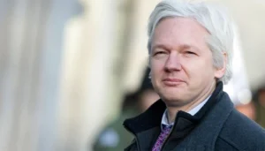 The plane carrying Julian Assange departs London, and he will appear in court on Wednesday.